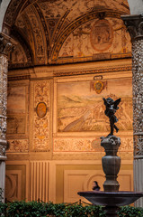 Detail of buidling Florence Italy Tuscany angel sculpture fresco in background