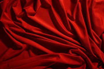 Wall Mural - Background image of crumpled fabric. Red cloth