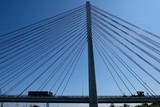 Fototapeta Mosty linowy / wiszący - Cable-stayed bridge on the Vistula river. Cars passing the bridge. Gdansk/Poland