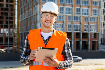 medium shot construction engineer using tablet