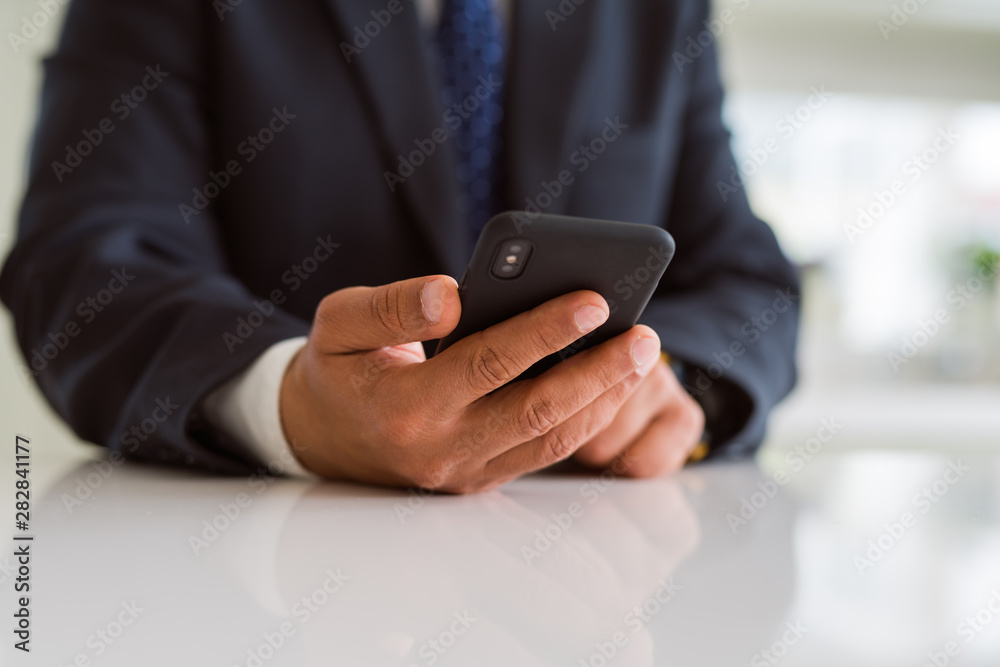 Close up of business man hands using smarpthone