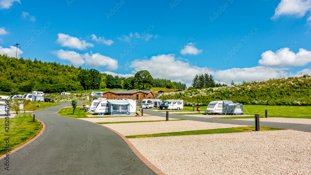 Red Kite Campsite, Llanidloes, Wales. A campsite for touring caravans, motorhome and campervans exploring mid-Wales, UK - obrazy, fototapety, plakaty 