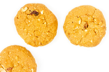 Oatmeal raisin cookies isolated on white background, top view.