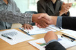 © 88studio - Business people shaking hands after meeting. colleagues handshaking. teamwork partnership concept.