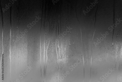 Fotomural Real glass Window with steam and condensation on surface raining Night