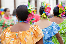 Dancers Dancing And Wearing One Of The Traditional Folk Costume From Puerto Rico.