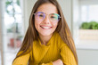 © Krakenimages.com - Beautiful young girl kid wearing glasses smiling looking side and staring away thinking.