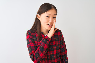 Wall Mural - Young chinese woman wearing casual jacket standing over isolated white background hand on mouth telling secret rumor, whispering malicious talk conversation