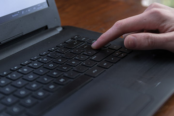 Boy using a laptop at a desk