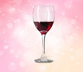 Red wine glass on wooden desk