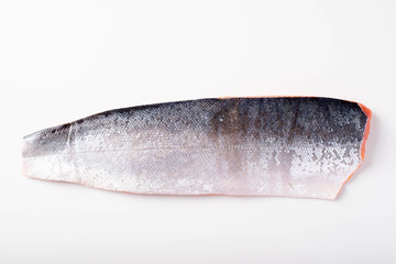 Poster - isolated skin side salmon fillet on white background