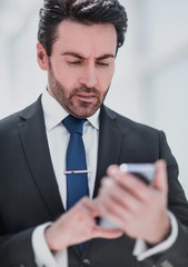 businessman reading text message on smartphone.