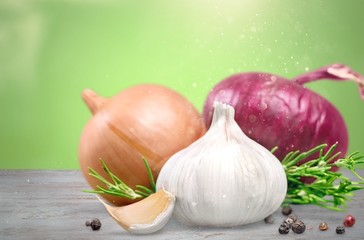 Wall Mural - Garlic and onion with peppercorn and parsley isolated on white background