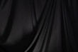 Black Curtain drape wave with studio lighting, Wallpaper Background Texture Detail