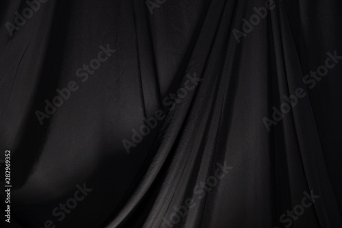 Cuadros en Lienzo Black Curtain drape wave with studio lighting, Wallpaper Background Texture Deta