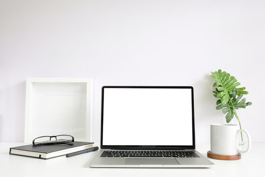 Workspace desk and laptop. copy space and blank screen. Business image, Blank screen laptop and supplies.