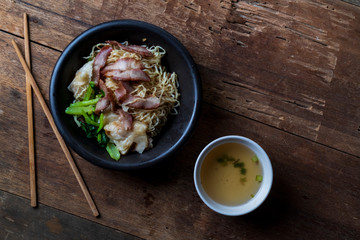 Traditional Thai egg noodles on wooden table top