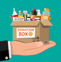 Wall Mural - Cardboard box full of drugs in hand. Needed items for donation. Different pills bottles, healthcare, pharmacy. Medical drug vitamin, antibiotic. Donate, charity, thanksgiving. Flat vector illustration