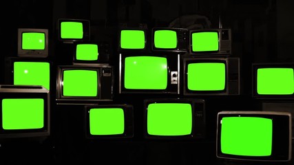 Wall Mural - stacked vintage tvs turning on green screens. you can replace green screen with the footage or pictu