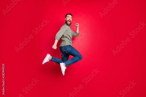 Cuadros en Lienzo Full length body photo of man having decided to do sport and started running whi