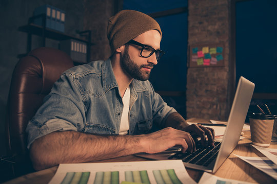 Confident guy working at late time answering colleagues email wear casual outfit sit modern office