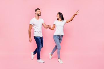 Poster - Full length body size photo of couple wearing jeans with girlfriend showing her man way to most famous sight of city while isolated with pastel background