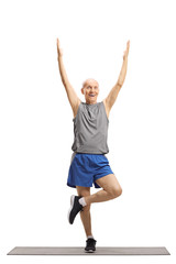 Canvas Print - Elderly man exercising and stretching a leg