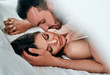 © Artem - The passionate man and woman playing in the bed