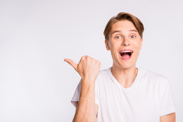 Wall Mural - Photo of cool guy indicating finger empty space wear casual outfit isolated white background