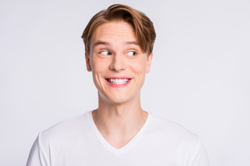 Wall Mural - Close-up portrait of his he nice cute attractive cheerful cheery glad curious funny guy looking aside guessing clue isolated over light white pastel background