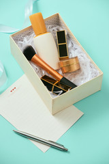 Sticker - Make up gift box with serum, blush, brushes, cream and lipsticks indoors