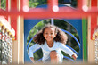 © Pixel-Shot - Cute African-American girl having fun on playground outdoors