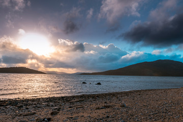 Wall Mural - Islands and Sea with Sunset in the Background