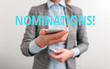 © Artur - Word writing text Nominations. Business photo showcasing action of nominating or state being nominated for prize Business concept with mobile phone and business woman