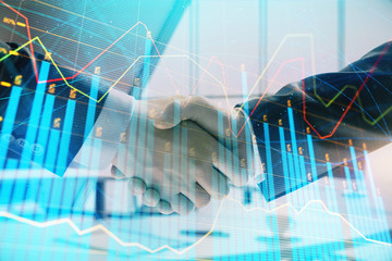 Multi exposure of financial graph on office background with two businessmen handshake. Concept of success in business