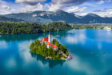 Bled, Slovenia - Aerial View Of Lake Bled (Blejsko Jezero) With The Pilgrimage Church Of The Assumption Of Maria, Pletna Boats, Bled Castle And Julian Alps On A Sunny Summer Day