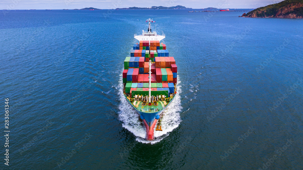 Aerial view container ship carrying container in import export business logistic and transportation of international by container ship in the open sea. - obrazy, fototapety, plakaty 