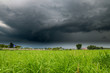 The Summer countryside landscape with a thundercloud