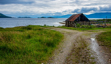 Stone And Corrugated Iron Fisherman's Hut In Beautiful Scenery