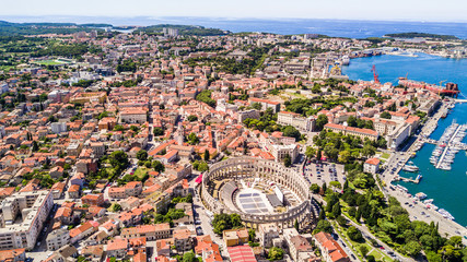 Wall Mural - Pula aerial drone shot of The Arena is the only remaining Roman amphitheatre to have four side towers and with all three Roman architectural orders entirely preserved.