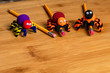 Fun Halloween Crafts.  3 Spiders made of pom poms and pipe cleaners.  Attached to pencils.  Negative Space for Copy