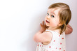 © rigg - Happy smiling funny toddler child girl on white background