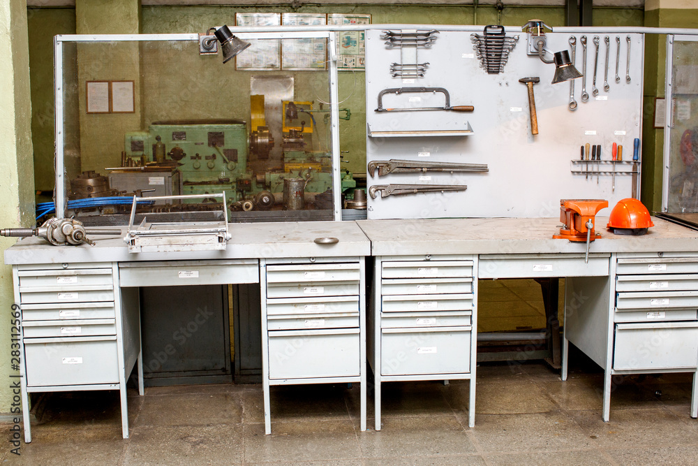 Old mechanical workshop - workbench with stand for hand tools - obrazy, fototapety, plakaty 