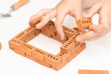 Construction Of Small Brick Blocks, Toy For Child Development On White Background.