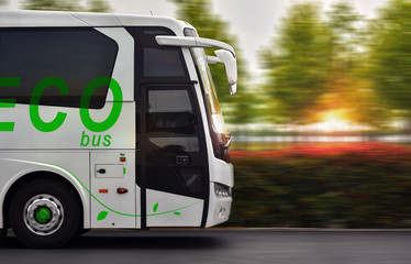 Wall Mural - ECO bus on fast speed on sunset background