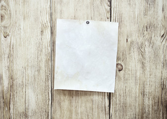 Sheet of paper for note on the vintage wooden board