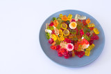 Fototapeta Londyn - Different kinds of gummy sweets on plate