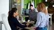 © DC Studio - Two businesswomen discuss the graphs in the report