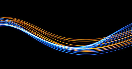 Wall Mural - Long exposure, light painting photography.  Vibrant streaks of electric blue and metallic gold color, against a black background.