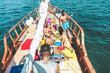 © DisobeyArt - Group of young people dancing in sailing boat party with dj playing music - Top view of friends having fun in summer vacation - Travel and tour holiday concept - Focus on disc jockey head